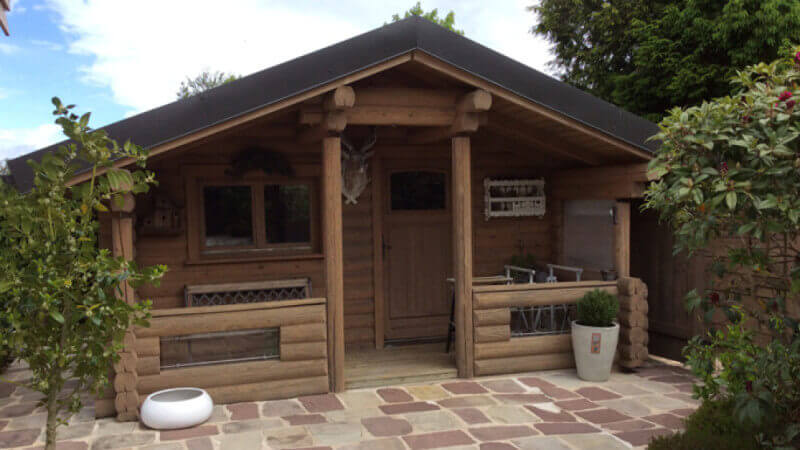The front of a small wood cabin chalet.