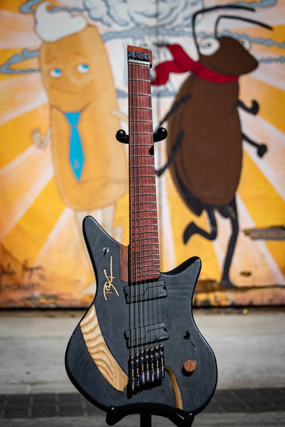 Ash, kekatong, maple and padouk wood guitar with matte finish.