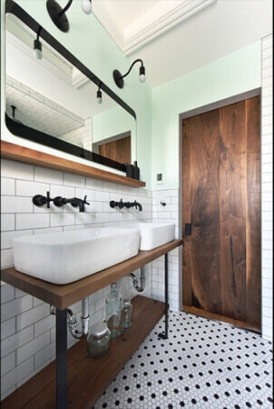 Bathroom remodel using salvaged black walnut accent pieces.