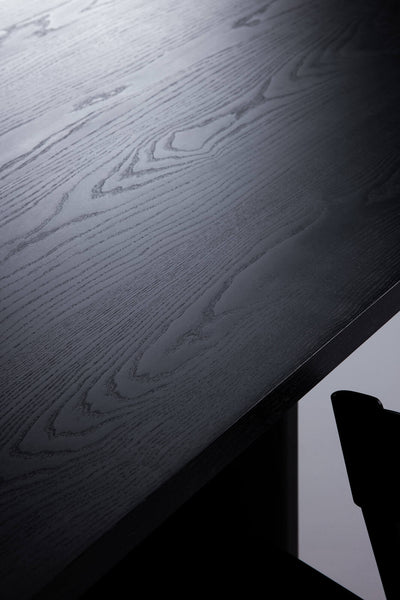Wood stained black where you can still see the grain